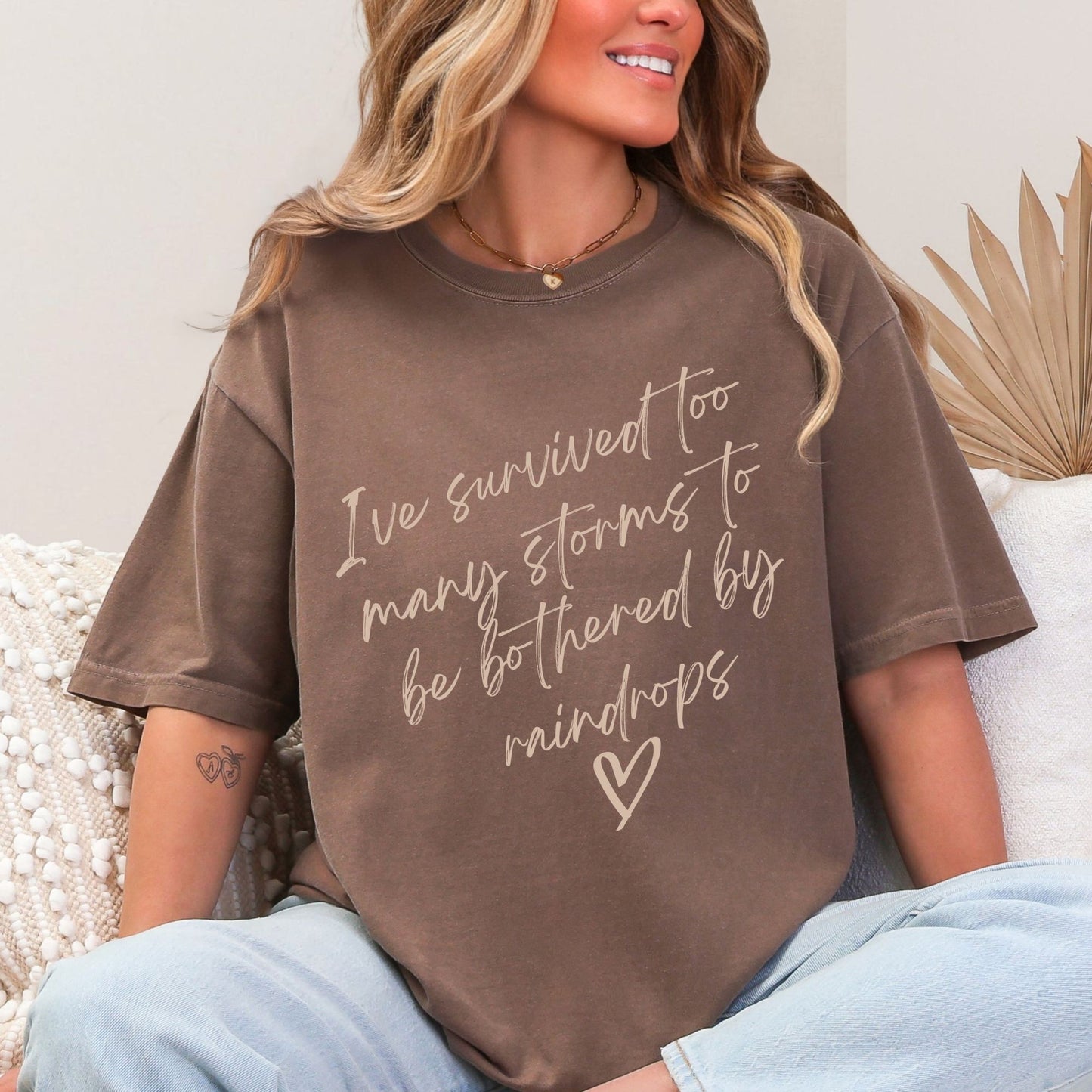 “I’ve Survived Too Many Storms to Be Bothered by Raindrops” Tee & Crewneck